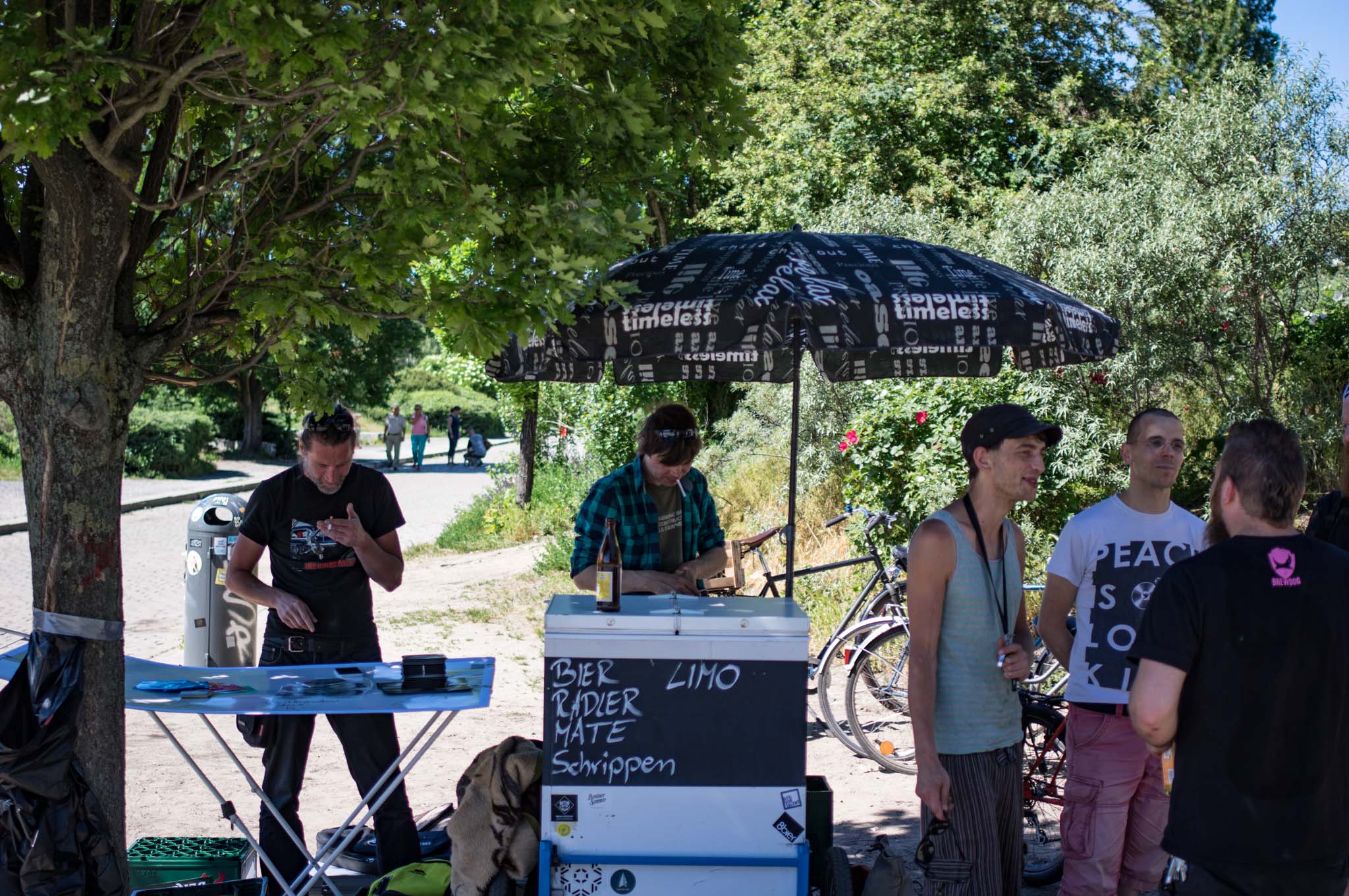 Guys selling beer and CDs at a concert in Berlin's Mauerpark June 2017
