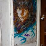 Srteet art in London: portrait of a young woman by c215