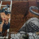 Two murals in London, a breakdancer and a heron by ROA