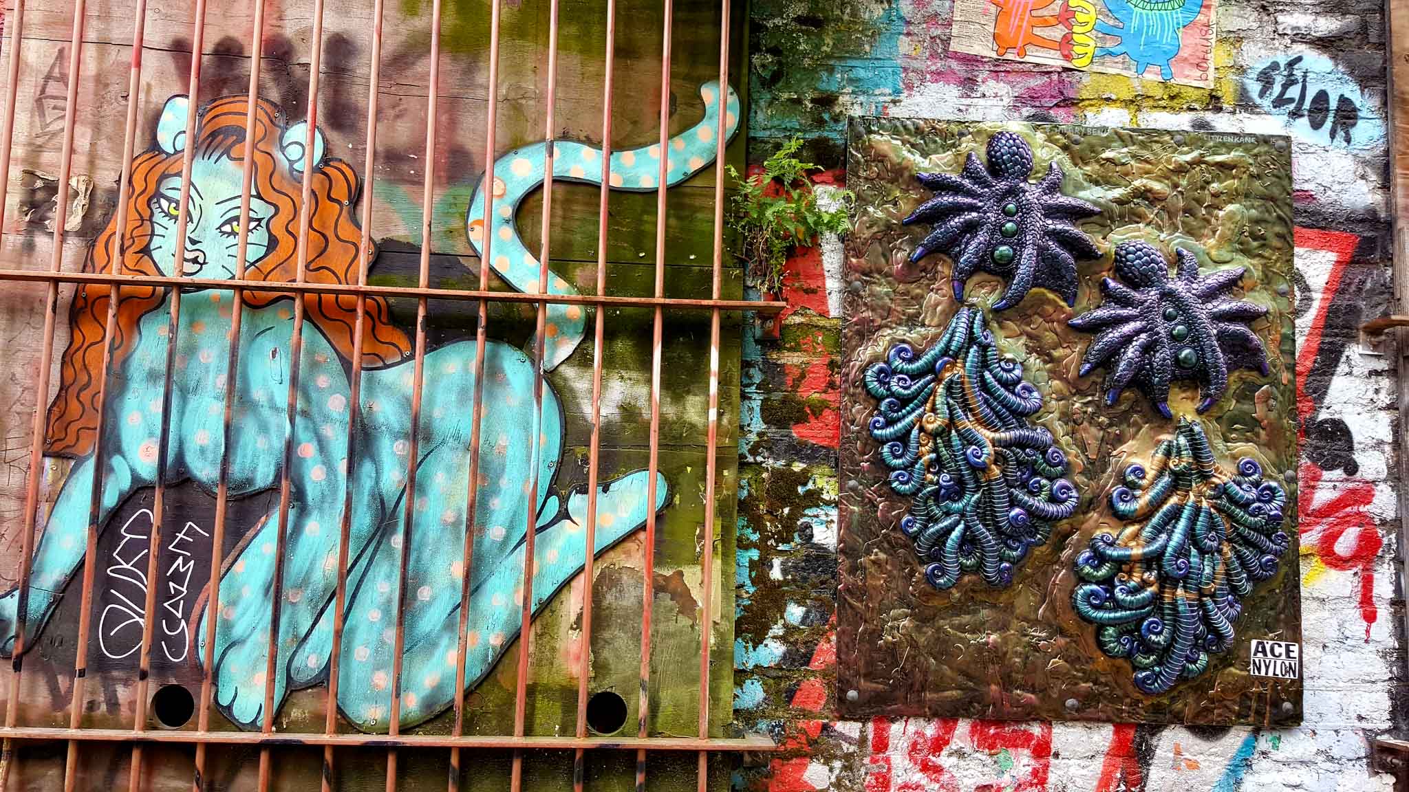 street art: catlady and a three-dimension purple octopus-thingy in london's Eastend