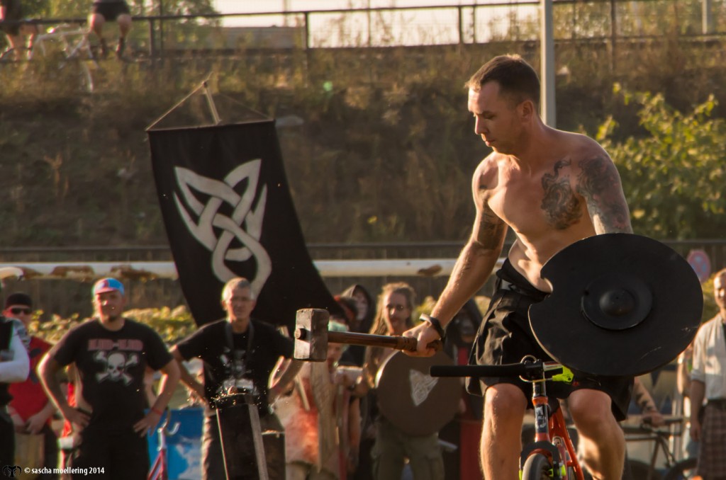 Berlin Pedal Battle, naked guy, tattoo, bike, hammer